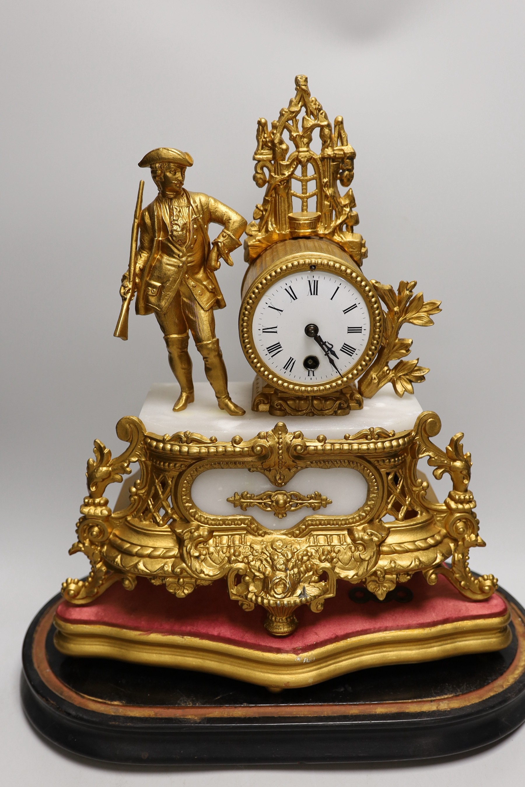 A French gilt metal mantel clock under dome. Overall 53cm tall